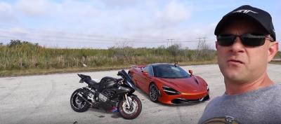 Motorcycle and car on track 