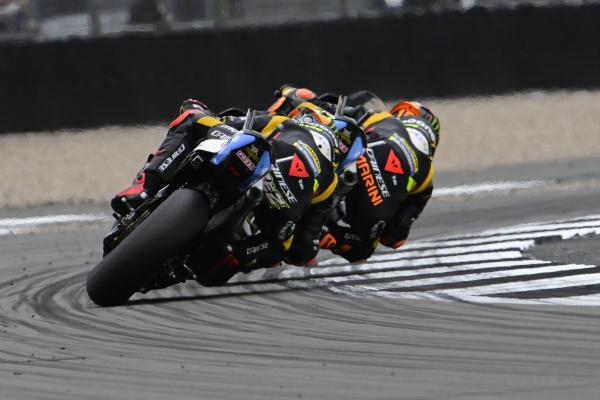 Luca Marini leads Marco Bezzecchi, 2023 MotoGP British Grand Prix. - Gold and Goose