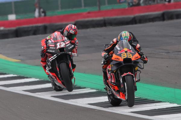 Brad Binder leads Maverick Vinales, 2023 MotoGP British Grand Prix. - Gold and Goose