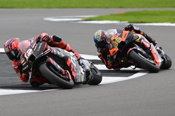 Maverick Vinales leads Brad Binder, 2023 MotoGP British Grand Prix. - Gold and Goose