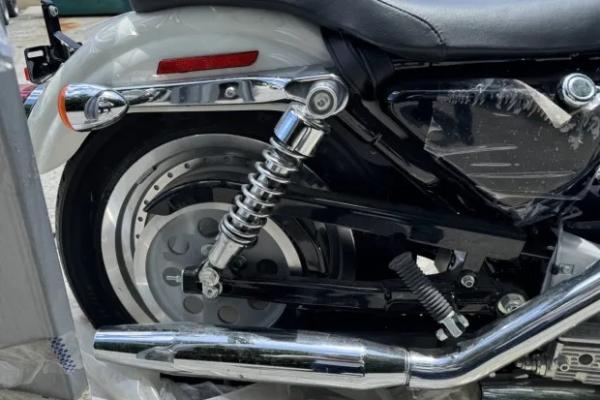 The rear suspension of a Harley-Davidson 883 Sportster