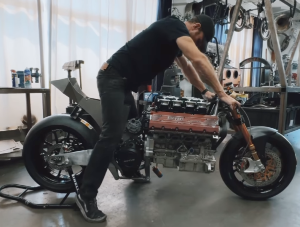 A man sitting on a motorcycle