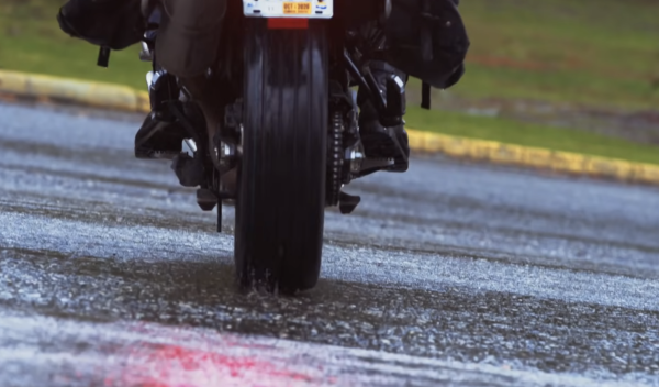 A car tyre fitted to the rear wheel of a motorcycle