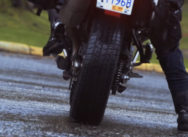 A car tyre fitted to the rear wheel of a motorcycle