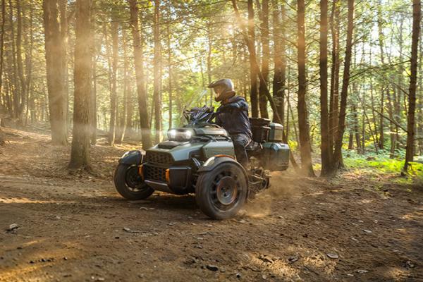 The Can-Am Canyon being ridden in a forest