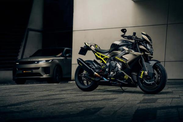 A custom BMW motorcycle and a Range Rover Sport SV