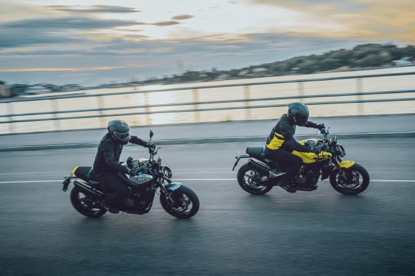 Two Husqvarna Vitpilen 801s riding along a coastal road