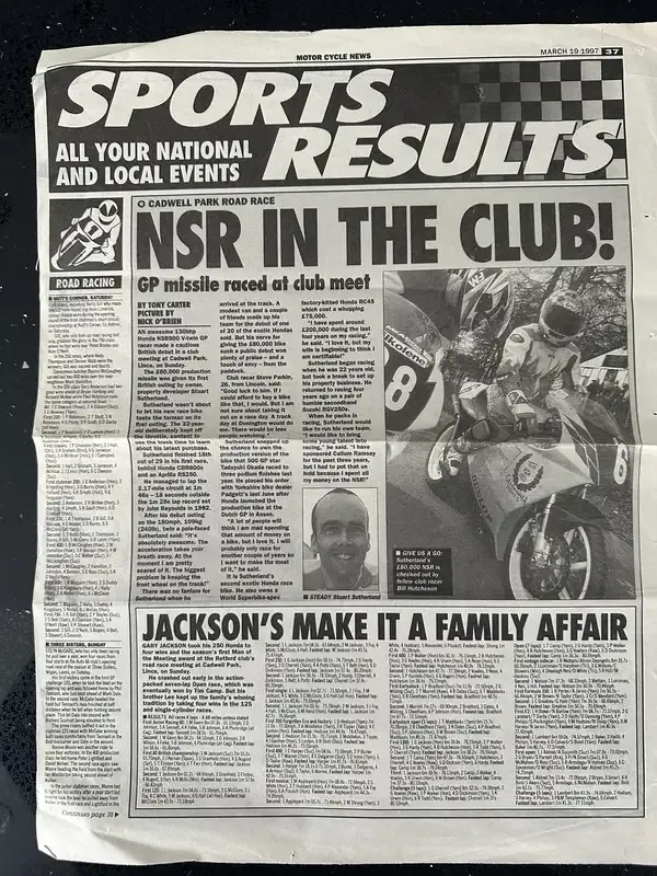 A newspaper clipping from the bike's racing days