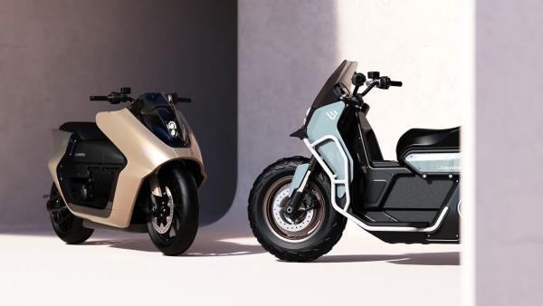 One bike is a rugged urban adventure scooter, while the other is more sleek and sporty