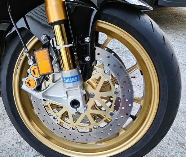 Ohlins forks are joined by Marchesini forged rims