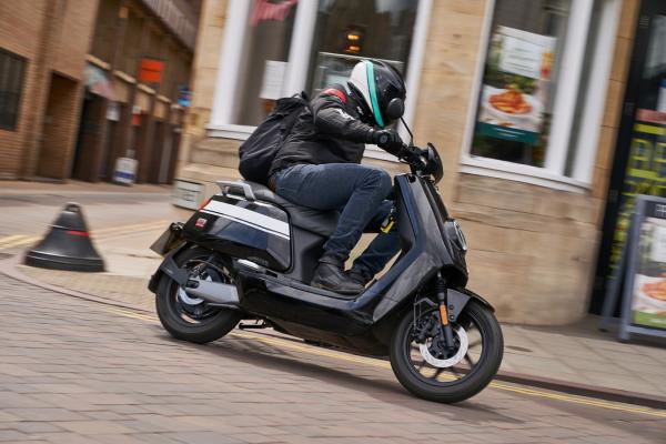 electric city commuter scooter riding