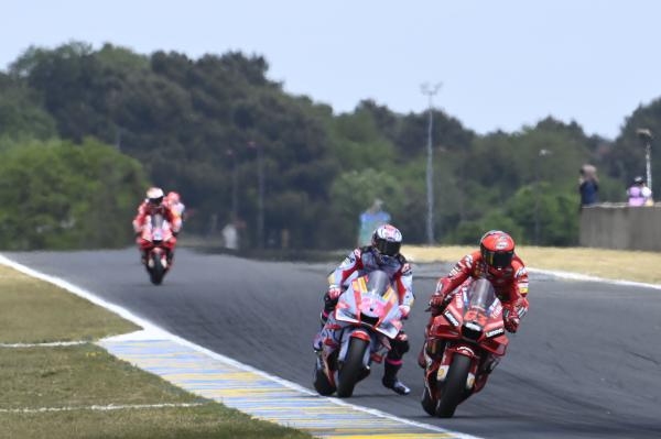 Francesco Bagnaia leads Enea Bastianini, 2022 French Grand Prix. - Gold and Goose