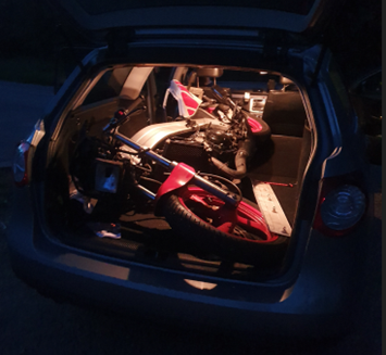 Will Norman's broken bike in the boot of his estate car.