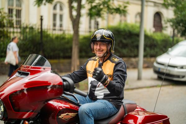 Jochen Zeitz riding a 120th Anniversary Harley-Davidson Street Glide