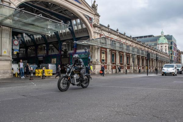 An electric bike riding past Smithfield Market in London