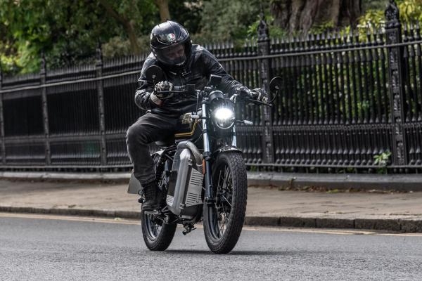 A motorbike riding past Regents Park London