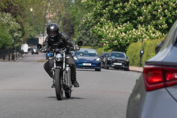 An electric motorbike riding past Regents Park London