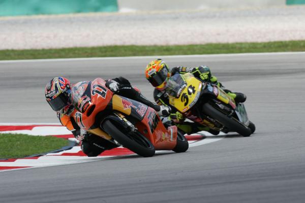 Casey Stoner, Andrea Dovizioso, 2004 125cc Malaysian Grand Prix. - Gold and Goose.