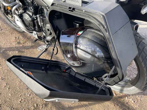 A motorcycle helmet in a pannier case