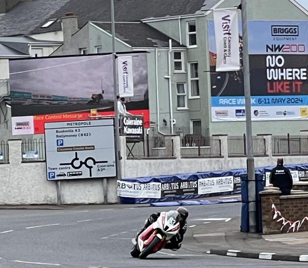 A race bike heading to Metropole Corner at the NW200