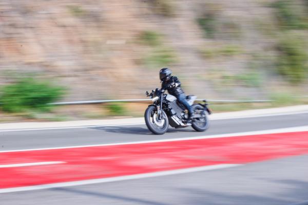 a motorcycle riding along a mountain road