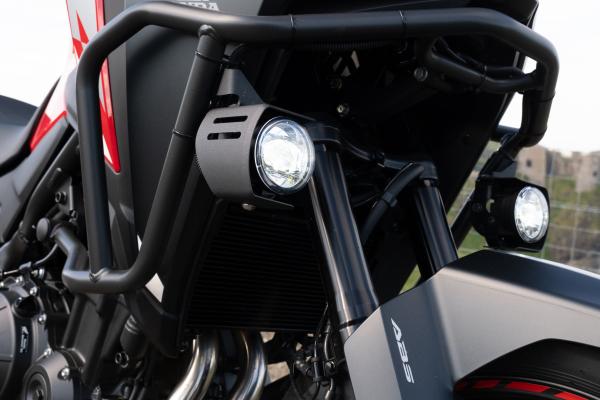 the headlight and crash bars of a Honda Motorbike