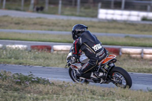 A Mini-GP bike being ridden around a track