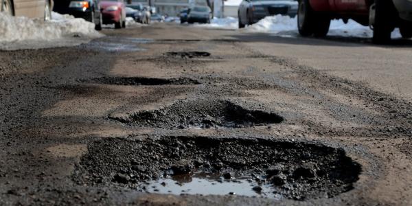 Government pledges £2.5bn to end ‘scourge’ of potholes
