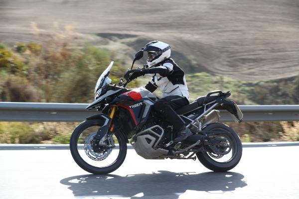 A motorcycle being ridden along a mountain road