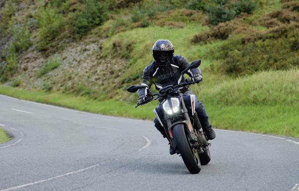 A KTM motorcycle riding around a corner