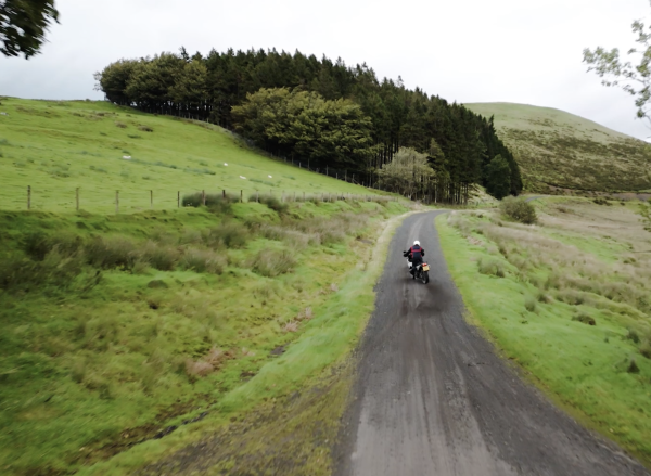 A KTM adventure bike doing a power slide off-road