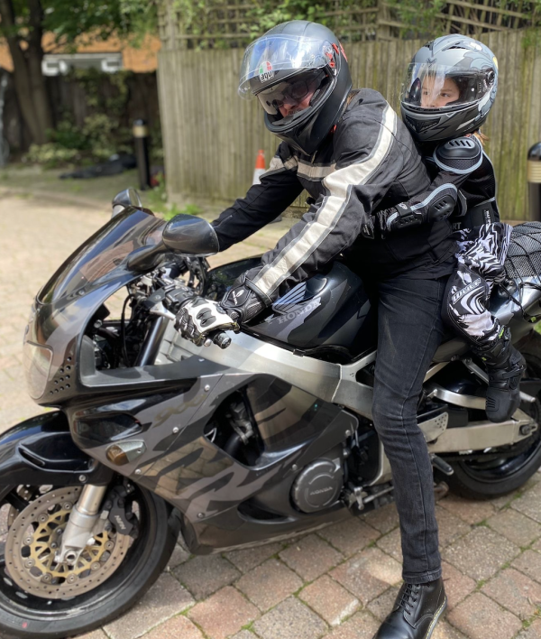 A Honda Fireblade with a young pillion 