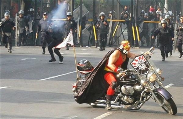 Bike mounted Luchador vs. Mexican riot cops