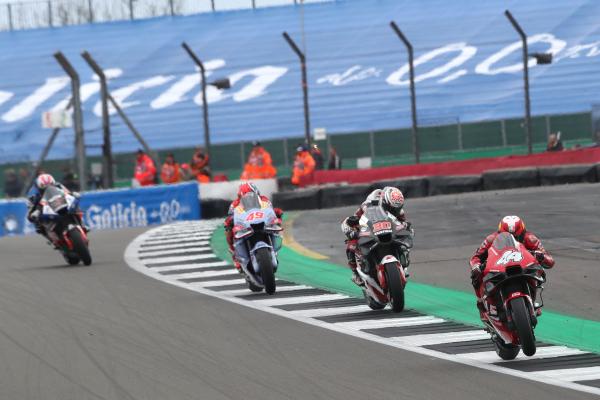 Pol Espargaro leads Takaaki Nakagami, Fabio Di Giannantonio, Iker Lecuona, 2023 MotoGP British Grand Prix. - Gold and Goose