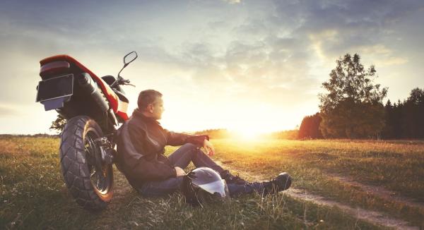 Man leaning on motorcycle