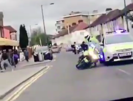 Policeman pushed from motorcycle in London