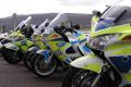 Police biker died after hitting bump in road