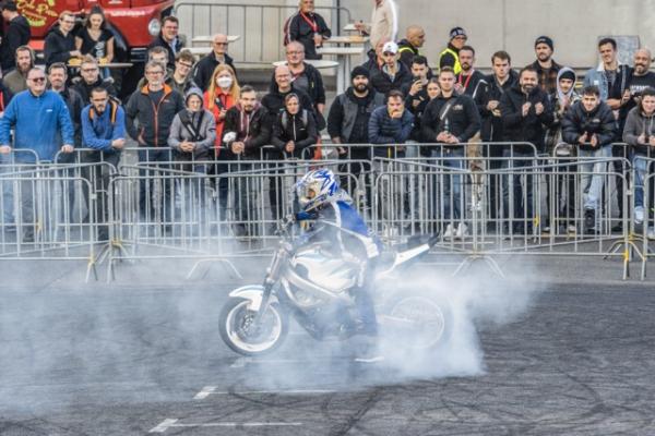 A motorcycle performing a stunt at a show