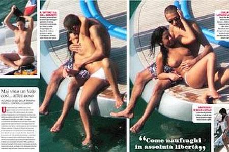 Paps snap Valentino Rossi kissing topless girl