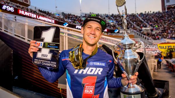 Christian Craig holds 2022 250SX West #1 plate and trophy after winning the title in Salt Lake City. - Yamaha Racing