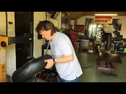 Amateur motorcycle tyre fitting with editor Alan