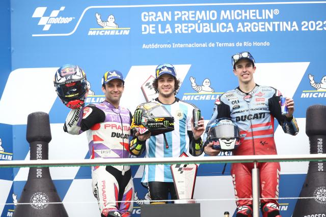 Marco Bezzecchi, Alex Marquez, Johann Zarco on 2023 MotoGP Argentinian Grand Prix podium. - Gold and Goose