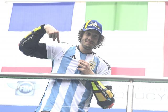 Marco Bezzecchi, 2023 MotoGP Argentinian Grand Prix podium. - Gold and Goose