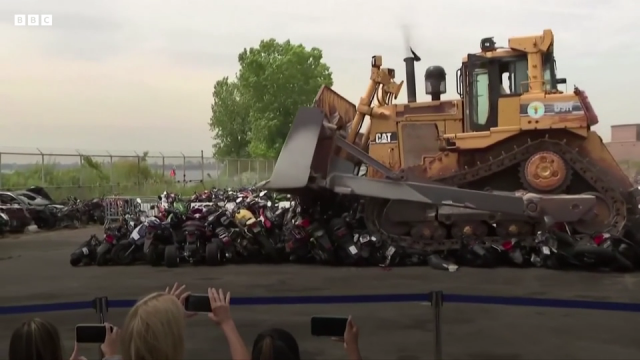 New York Bulldozer crushes 100 motorcycles. - BBC