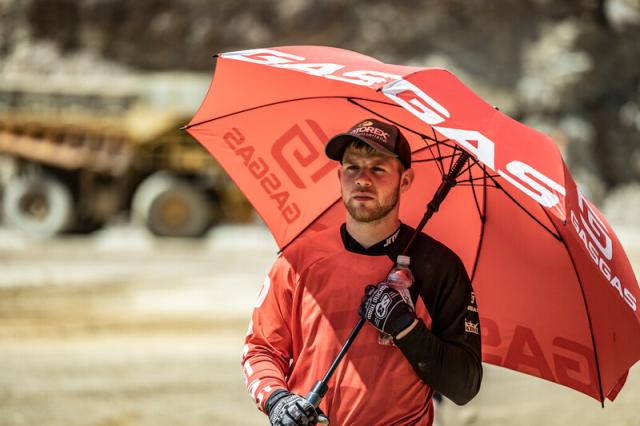 Tom Minta holds GasGas umbrella at Red Bull Erzbergrodeo. - GasGas Media/Marcin Kin