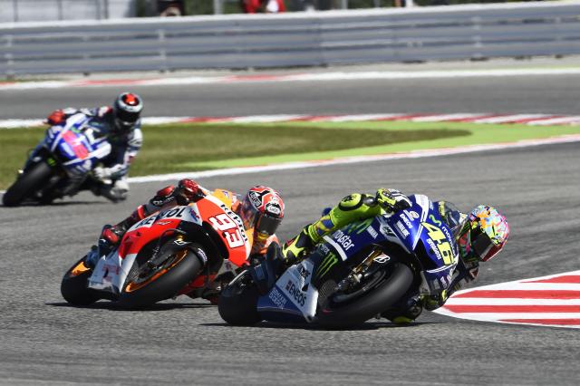 Valentino Rossi leads Marc Marquez, 2014 MotoGP San Marino Grand Prix. - Gold and Goose