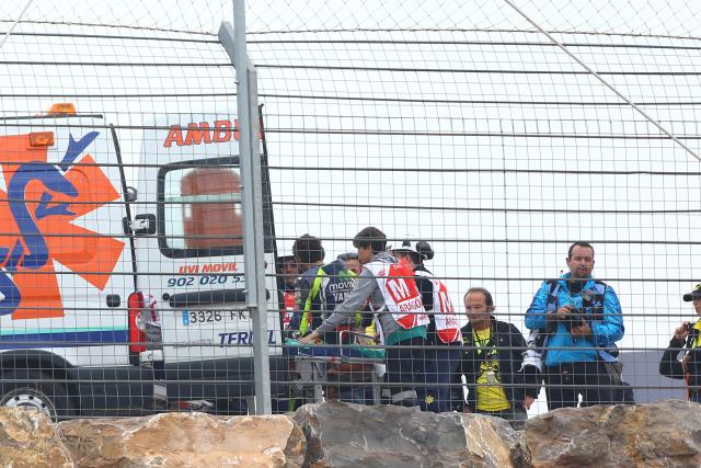 Valentino Rossi on stretcher, 2014 MotoGP Aragon Grand Prix. - Gold and Goose