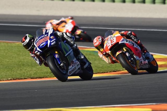 Jorge Lorenzo leads Marc Marquez, 2015 MotoGP Valencian Grand Prix. - Gold and Goose