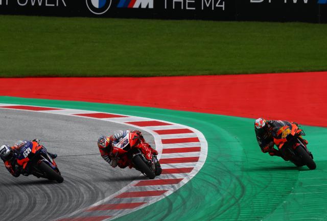 Miguel Oliveira passes Jack Miller and Pol Espargaro in the final corner to win the 2020 Styrian Grand Prix. - Gold and Goose