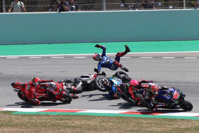 Alex Rins launched from Suzuki after turn one contact with Takaaki Nakagami, 2022 Catalan Grand Prix. - Gold and Goose